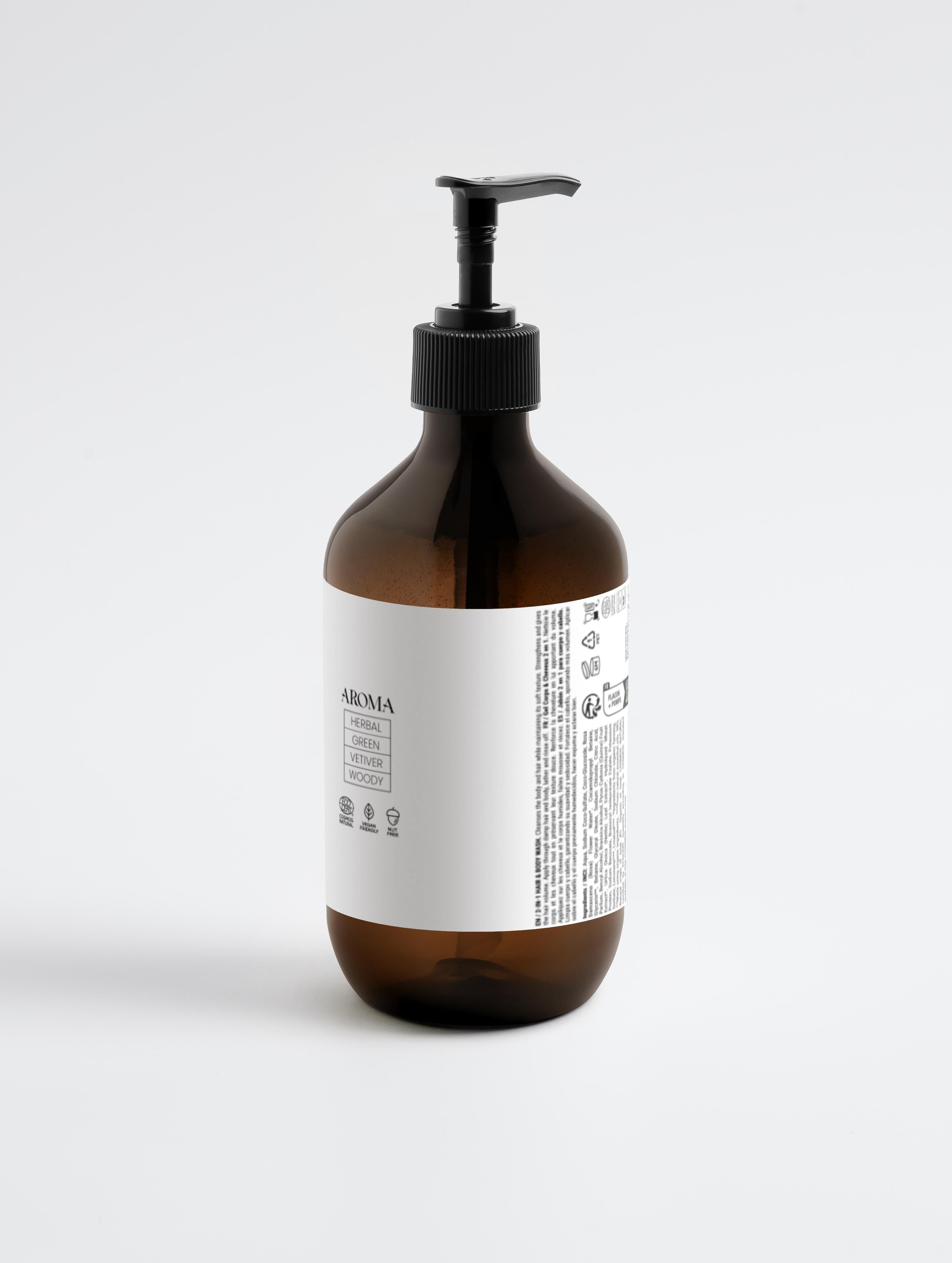 Brown bottle with black pump and white label on a light gray background